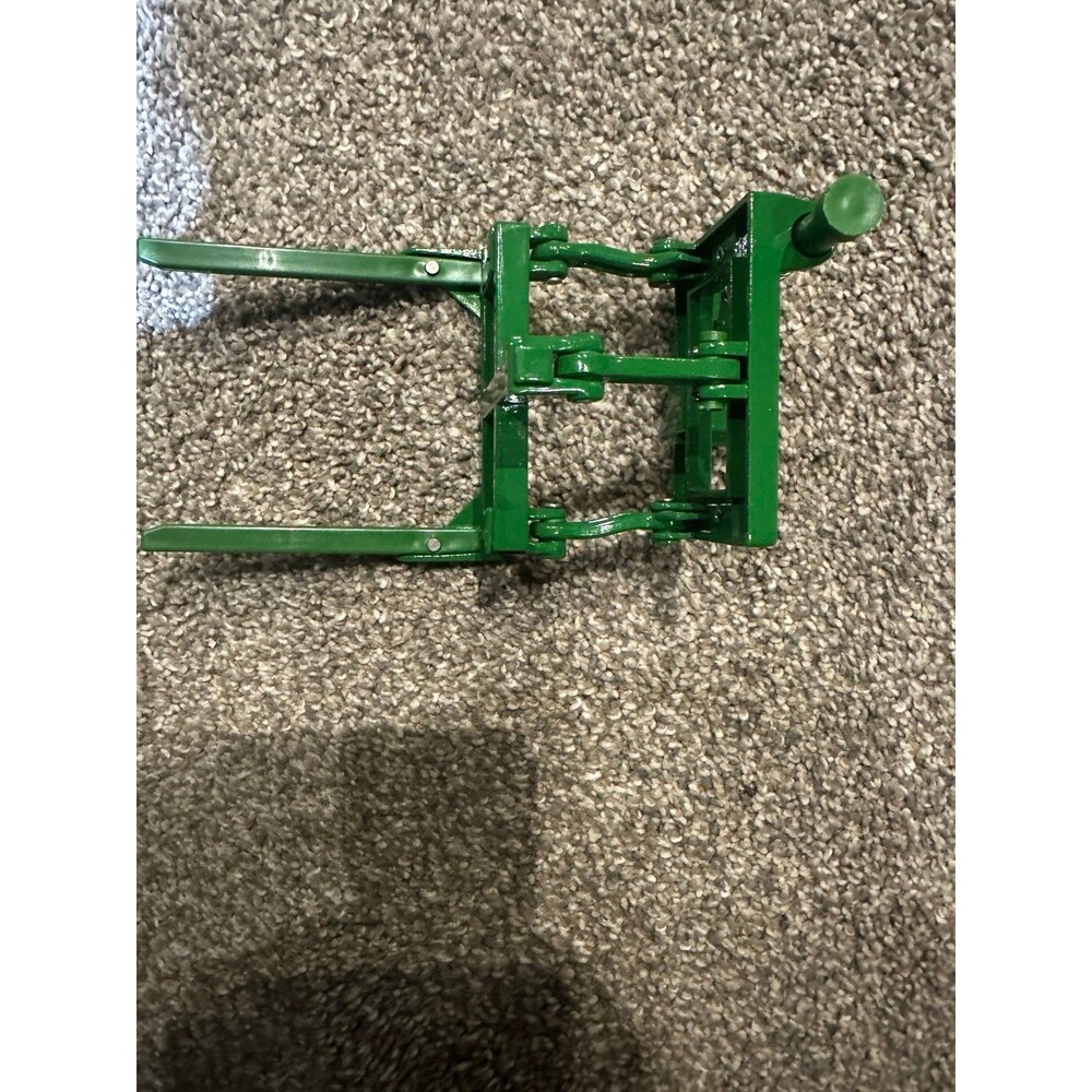 Ertl metal fork lift to attach to John Deere toy tractor